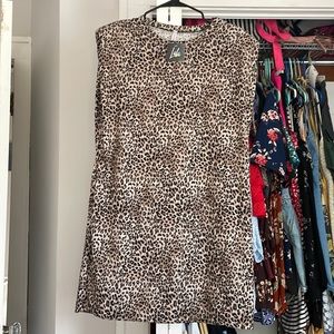 Dressed in Lala cheetah shift dress with pockets & shoulder pads
